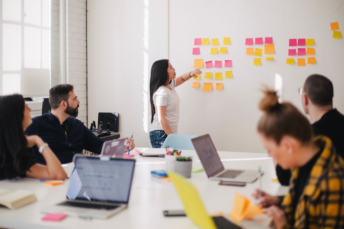 Team meeting and networking in modern office environment, verifying company legitimacy