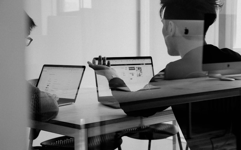 Professional working remotely with laptop and coffee