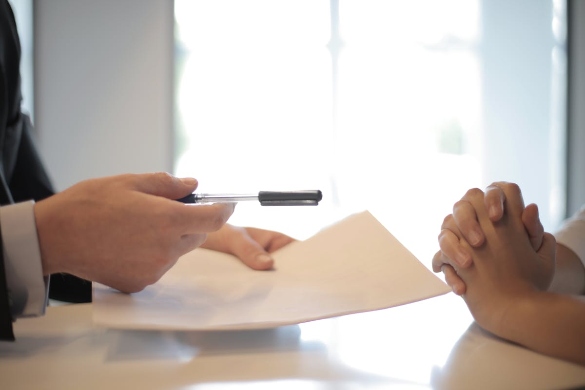 Professional reviewing their remote job resume during a video call